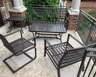 Alternate View - Outdoor love seat - Crate and Barrel - comes with orange cushions and striped pillows. MEASUREMENTS: 33"H x 63"W x 32"D. $475.