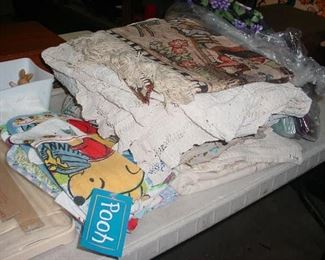 Much vintage needlework, table cloths, and more