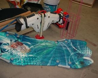 Boogie board, ski boots, tennis ball carrier