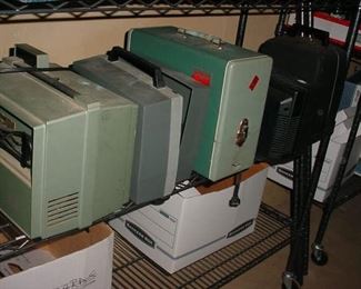Several vintage 8mm projectors and slide projectors