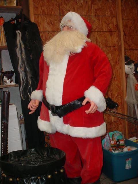 A full size Santa display figure with toy sack