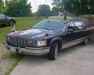 This great old collectible car hearse with various funny signs, such as we bury dead people.