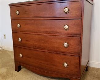 One of two mahogany four drawer chests