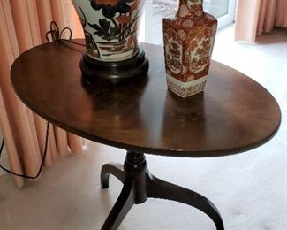 Antique mahogany oval tilt-top table 