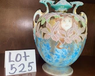 Lot 525.  $60 .00 as is. This Victorian and/or Art Nouveau portrait vase is very very cool but is not in perfect condition.  It depicts a girl under a piece of netting, and the colors are amazing.  The damage this has is on the back and doesn’t readily show, but it’s clearly there.  It looks to have unusual multiple raised coloring and floral detailing however we cannot track down the maker.  Check out further photos.