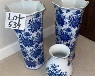 LOT 539.  $50.00  Three Pieces of Blue and white porcelain - two 19” tall floor vases and one 10” tall vase.  The tall ones have interesting scalloped edges and would look charming holding tall dried grasses,  cattails, or your umbrellas or cane collection.  The shorter one could hold just about any bouquet and be a focal point of your home.