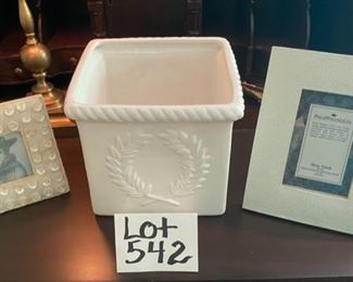 Lot 542.  $15.00  Lot of three items - Philip Whitey Frame 4x6, Small white frame with buttons 3x3, and square porcelain vase; in the center.  