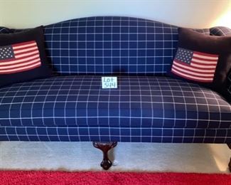 Lot 544.  $495.00.  Chippendale Style Blue Camelback sofa, from the Sherrill showroom at the Merchandise Mart with blue & white checked/ plaid fabric, (and by the way we have an extra bolt of fabric for you) Carved claw legs, with 2 Ralph Lauren American Flag pillows.  Measures 86” long x 36” deep, x32” high.   This seems like such a fun patriotic sofa, especially paired with the red shag area rug coming up on another lot.  Beautifully made and quality fabric.