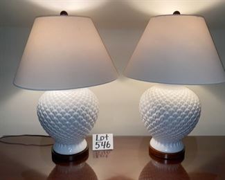 Lot 546. $150.00  for Two Ralph Lauren White (Artichoke or Pineapple?) lamps. 26” high and 18” shade.  White baluster form, with a repeating pattern.  Nice lamps fit in with all kinds of style. 