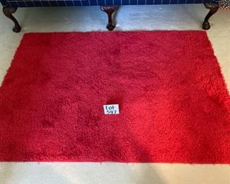 LOT 547. $45.00   Red shag carpeting. 48" x 68"