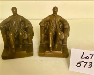 Lot 573. $40.00  Bronze Seated Lincoln Bookends. One has a repair on the neck. 7" x 5.5" each