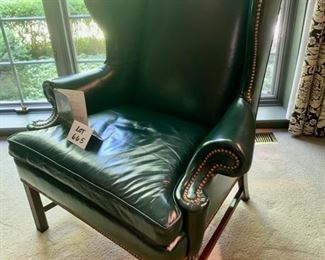 Lot 665. $350.00   Hancock & Moore, green leather wing chair. Wing depth is 16", 46" tall to back of the chair. 