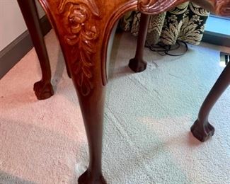 Lot 667. $895.00 This accent table is just jaw-dropping.  Round, burlwood carved leg, and surround accent table. This solid wood table with carved ball and claw feet is from the Sherril showroom at the Merchandise Mart.