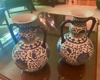Lot 669.  $60.00 Pair of blue and white, ceramic double-handled urns. 15" tall, 10" center diameter