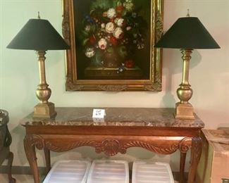 Lot 671. $525.00 Gorgeous carved, hardwood, marble top sofa table with ball and claw feet.  60"w by 19"d by 31.5"tall.   Chapman Lamps and Painting are available in lots above. 