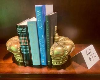 Lot 672.  $40.  Pair of heavy crown bookends. 6.5" tall with 4 books.