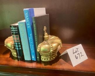 Lot 672.  $40. Pair of heavy crown bookends. 6.5" tall with 4 books.