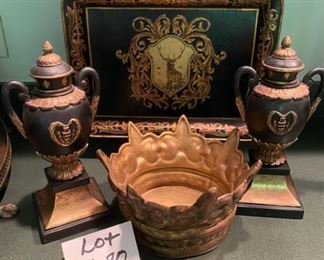 Lot 680.  $35.00. An assorted collection of gold-look crowns: 9.5"x6", 2 lack gold urns 12.25"tall, hand-painted metal tray with stag & gold trim 16"x12" and 1 crown candle base (there are smaller versions of this later in a royal lot)! 