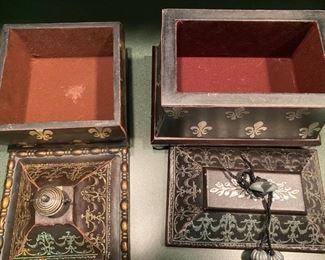 Lot 685.  $18.00  2 faux leather covered boxes with Fleur de lis stamped design.