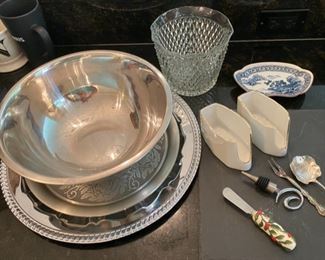 Lot 688.$25. 12 pc misc set, slate cheese square, 2 platters, stainless mixing bowl, glass ice bucket, 2 silverware caddy, fork, spoon, spreader, and wine topper, blue and white porcelain tidbit dish.