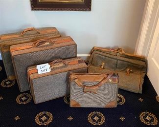 Lot 558. $225.00.   5 pc Coveted  Tweed Vintage Hartmann Luggage in fabulous condition with brown leather trim, garment bag, tote, and 3 suitcases (25"x18", 24"x18, 21.5" x 12").  Hartmann is a premier name in luggage, and this tweed pattern with carmel colored leather trim is very sharp looking.    Great Price for a 5 Pc set....