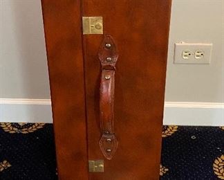 Lot 562. $50.00  Leather umbrella stand, gold emboss trim. 24"x 10.5".  Very Unique Gift Idea.  Shaped like a Suitcase on one side.