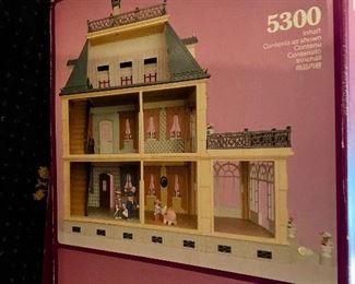 Lot 578. $225.00  Playmobil #5300 Victorian Mansion in original Box. Our daughter had this same dollhouse and she played with it constantly.  Playmobil makes a quality product.