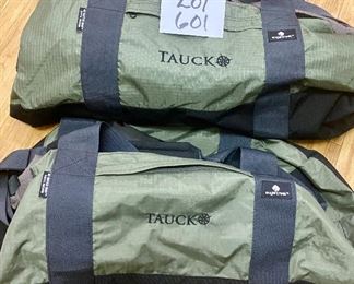 Lot 601. $20.00. 2 Tauck duffel bags 25" long. Tauck Tours is probably the finest touring company on the planet.  Definitely one of the most expensive as well.  It doesn't surprise me that they would give duffle bags to their clients.  High quality.   Great condition.