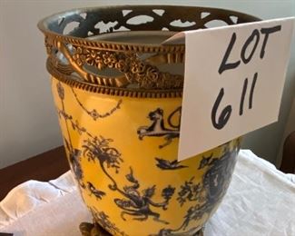 Lot 611. $20.00  Painted porcelain planter or canister  with brass accents on the rim and footed brass stand