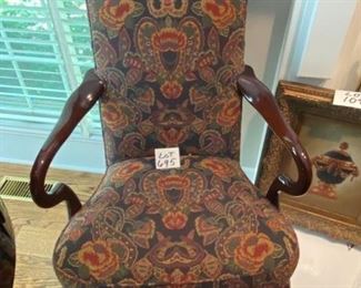 Lot 695. $325.00  Beautiful Accent Armchair by Hancock and Moore. We believe the wood is mahogany, with Cabriole legs and the arms look almost human, don't they?    The fabric is an updated paisley look.  Definitely a Unique, Regal and interesting (and comfy) chair! 