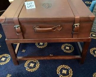 Lot 697. $275.00   Here's a Leather Suitcase that sits in a base. Together, it makes an adorable side table, and you can store your treasures in the suitcase as well. The owner loved it so much and paid an obscene amount for it.  Now she has nowhere to put it!  Owner paid of $1100.00 at the Merchandise Mart, Opens to storage.  27" W x 18" D  x 20.5" H