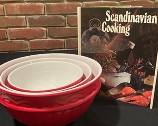 Lot 736. $15.00. Set of 3 Red  mixing bowls with a Scandinavian cookbook