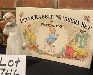 Lot 746. $25.00.  Peter Rabbit Nursery set by Wedgewood- plate, bowl & mug and a cute  Lladro Wannabee girl holding doll