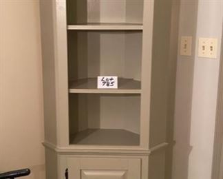Lot 785. $225.00.  Super nice, cute, gray corner cabinet with 4 shelves and lower door with shelf storage. 79"t by 26"w by 13.5"D