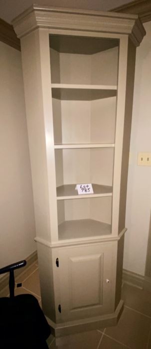 Lot 785. $225.00.  Super nice, cute, gray corner cabinet with 4 shelves and lower door with shelf storage. 79"t by 26"w by 13.5"D