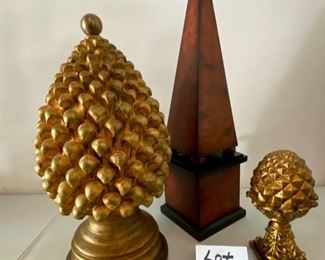 Lot 771.  $56.00. This is a stunning lot. 1 Gold acorn/bubble decorative accent 22" tall and 10" round base (heavy, it's super heavy), a small gold acorn on a stand, and a covered wood (?) obelisk with a gold finial (has storage inside).  