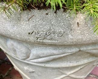 Lot 819  $300.00 Signed, concrete planter, with established decorative live fir tree 22" H  x 23" diamanté's