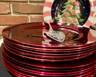 Lot 873.  $25.00. The Holiday Hostess: 8 13" Red Chargers, 8 Red Chargers made of Melanine. 1 11" Cookie Plate and 1 Merry Christmas C\Server