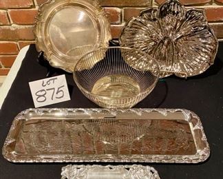 Lot 875.  $40.00.  Christmas Hostess: 1 20" x 7" Silver Plated Tray, 1 Floral Chrome Candy Tray, 1 10" Silver Plat Tray, 1 Round Meta; Bread Basket and Liner, 1 7.5" x 3.5" Arthur Court Grape Pattern Butter Dish.