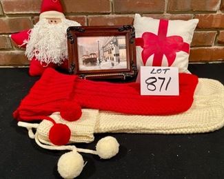 Lot 871. $45.00.  A Marshall Field Christmas: 5" x 7" Framed and Signed Giclee of Marshall Fields, 2 Knit Christmas Stockings, 1 Star Shaped Santa Pillow 