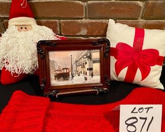 Lot 871. $45.00.  A Marshall Field Christmas: 5" x 7" Framed and Signed Giclee of Marshall Fields, 2 Knit Christmas Stockings, 1 Star Shaped Santa Pillow 