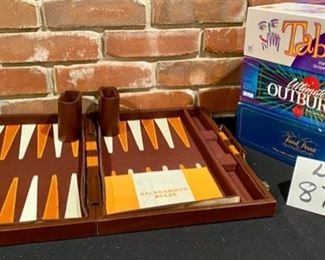 Lot 877  $25.00  Family Game Night (backgammon, taboo, outburs and trivial pursuit)