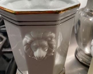 Lot 622.  $20.00   Set of jars and pitchers. Restoration Hardware metal jar, 8" white pitcher, 9" covered urn, Seagrass covered jar candle, lion handled jar, and Silvertone Coffee carafe.