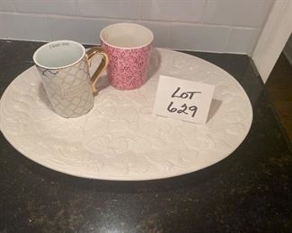 Lot 629.  $15.00  White Señor Ceramic oval platter with Floral and Leaf Pattern and Pink Starbucks Mug as well as Mom White and Gold Mug