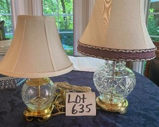 Lot 635.  $25  Two small lamps - one 17" Waterford crystal lamp; shade is nice but needs a cleaning; other lamp is glass made to look like crystal with a brass colored base 12.5" tall, small spots on the shade as well.  Price reflects the need to dry clean or replace the shades..