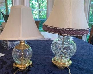 Lot 635. $25. Two small lamps - one 17" Waterford crystal lamp; shade is nice but needs a cleaning; other lamp is glass made to look like crystal with a brass colored base 12.5" tall, small spots on the shade as well.