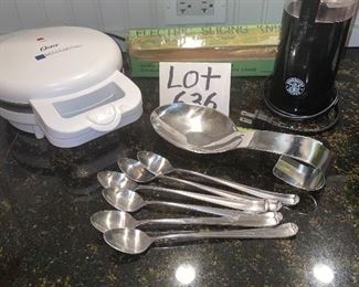 Lot 636. $25.00.  One Starbucks Coffee Bean Grinder, Oster Belgian Waffle Maker, One vintage avocado green electric knife in box, 6 iced tea spoons and one silver metal spoon rest by AMCO