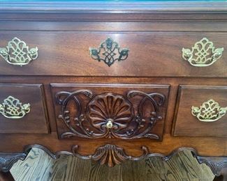 Lot 661. $650.00  How lovely is this piece?!  Council Craftsmen, 4 drawer chest with a glass topper. Beautiful woodwork accents, ball, and claw feet. 