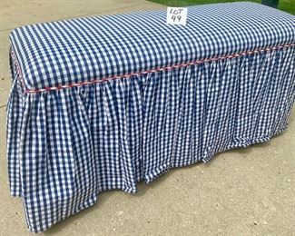 Lot 49 $50.00   Navy gingham check rolling padded bench, with red gingham piping - Measures 48" x 19" deep x 24" tall