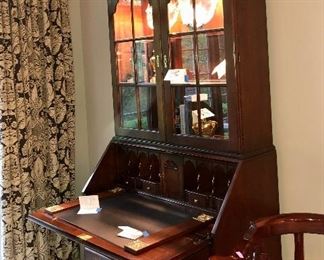 Lot 670A. $550. Statton Americana Mahogany secretary. Keyed drawers, upper glass door shelves are lighted! Display and functionality! 93"  by 22" base by 38" w.